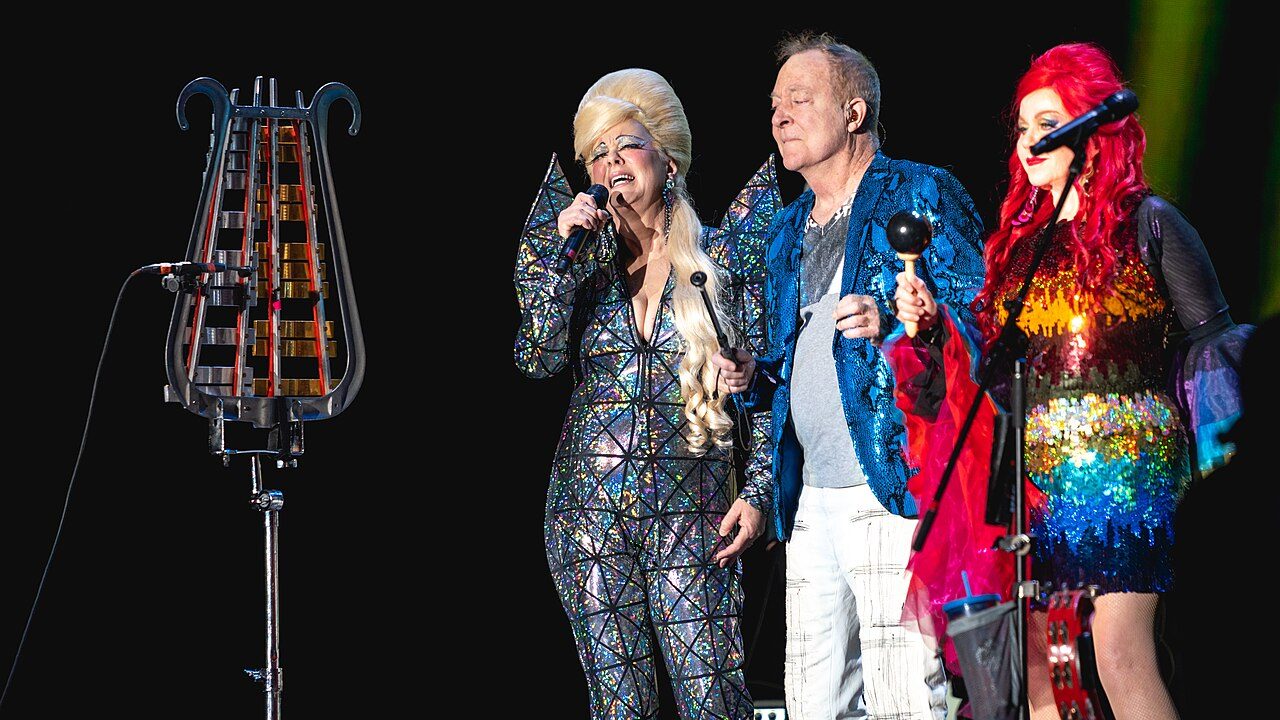 Cindy Wilson, Fred Schneider and Kate Pierson of the B-52s performing in sequins in 2019