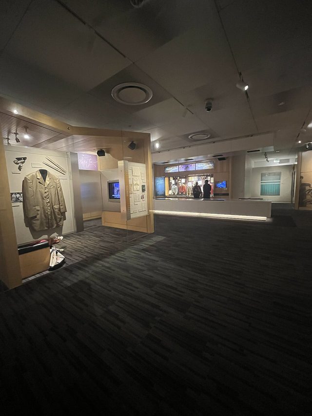 A dimly lit exhibit gallery inside the Grammy Museum at L.A. Live
