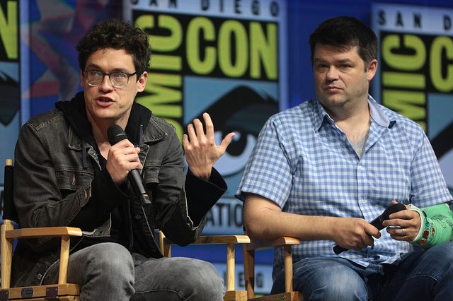 Phil Lord and Christopher Miller speaking on a panel at San Diego Comic-Con in 2018