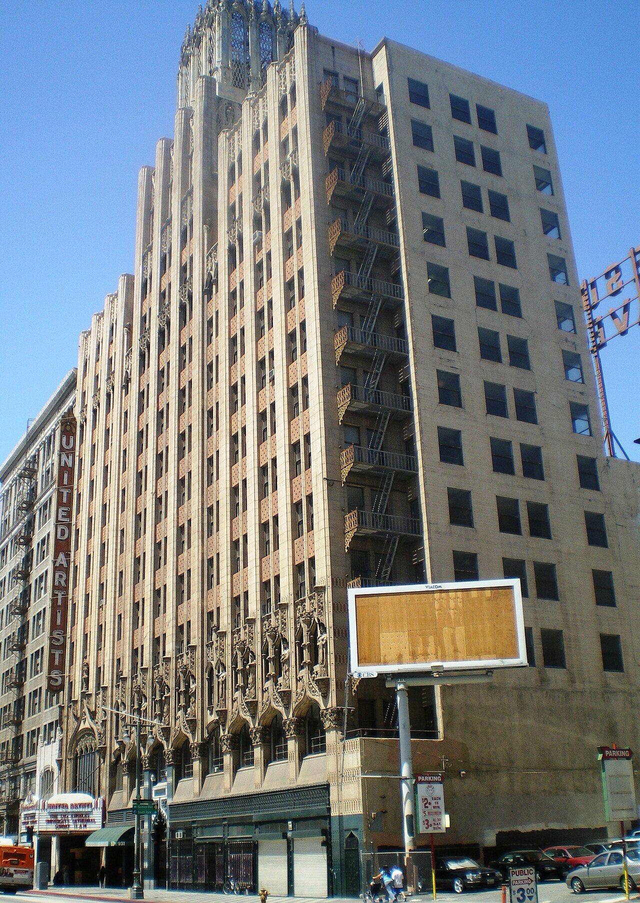 The Gothic tower and vertical sign of the United Artists Theatre building on Broadway in downtown Los Angeles