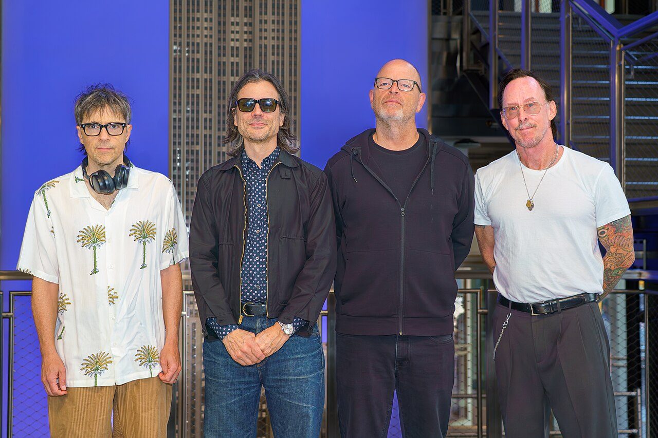 The four members of Weezer at the Empire State Building in 2026