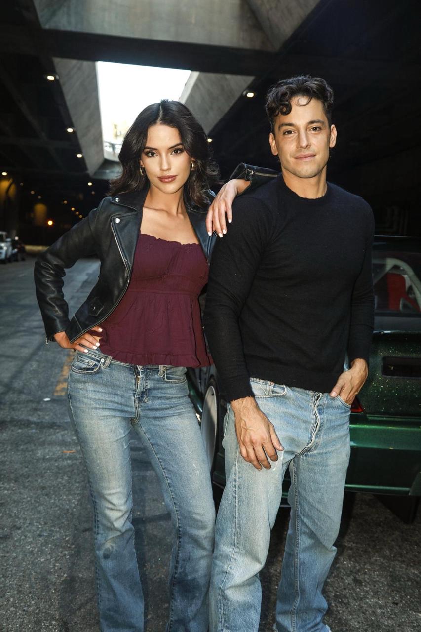 RYDE key art, a man and a woman posed beside a car beneath a Los Angeles overpass
